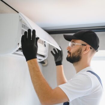 Repairman Fix Air Conditioning Systems, Male Technicians Service For Repair And Maintenance Of Air Conditioners, Air Conditioning Technicians Install New Air Conditioners In Homes